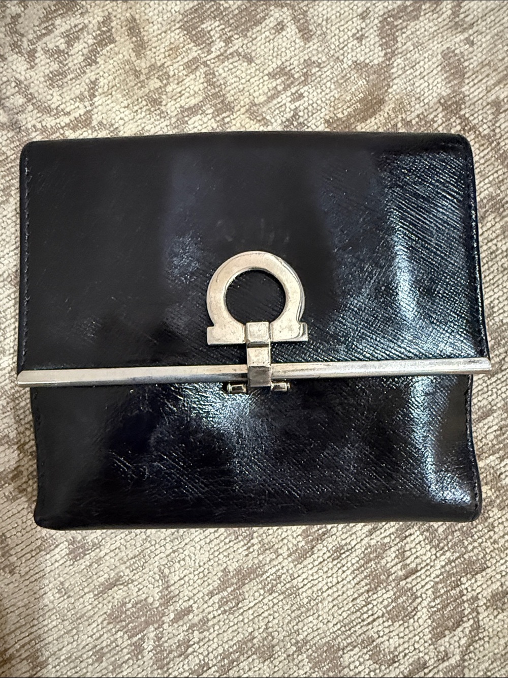 Salvatore Ferragamo EUC black leather wallet featuring Gancini clip closure